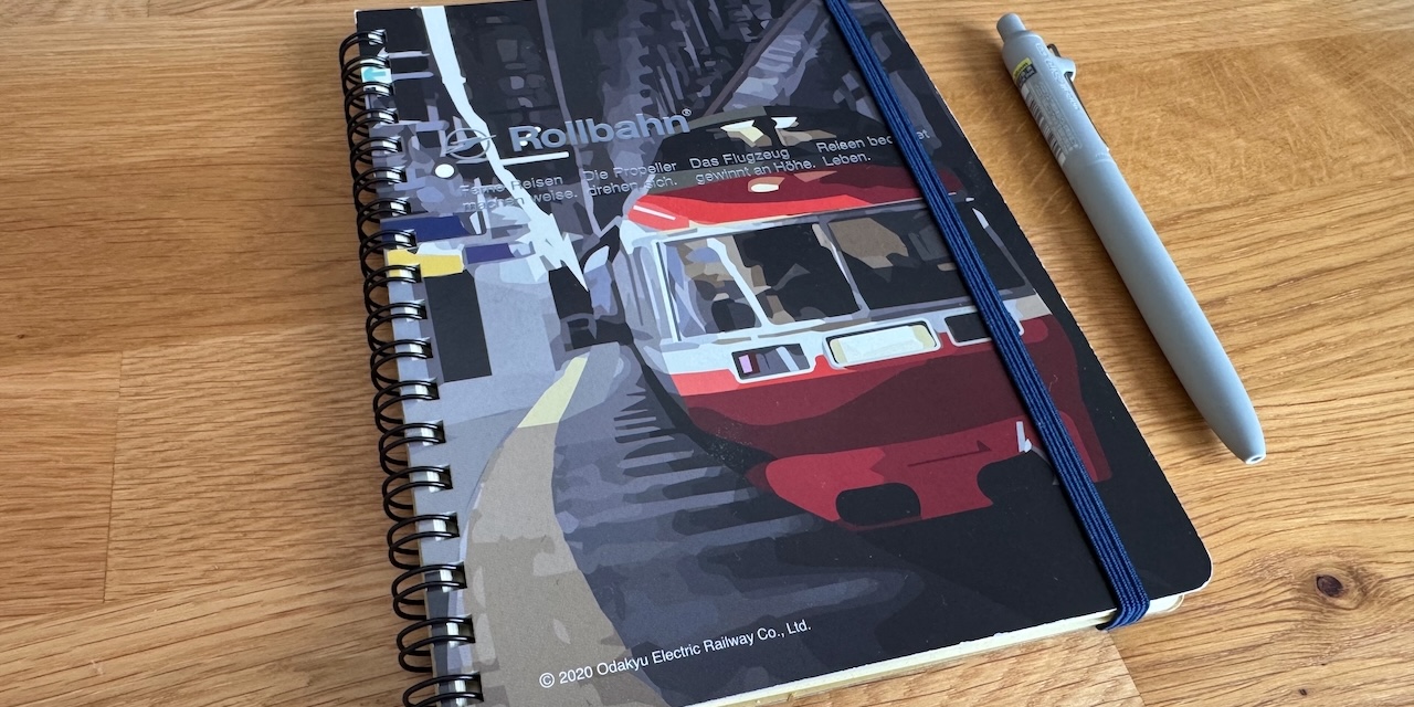 An image of my Rollbahn notebook. It features an illustration of a train on Japan's Odakyu line.
